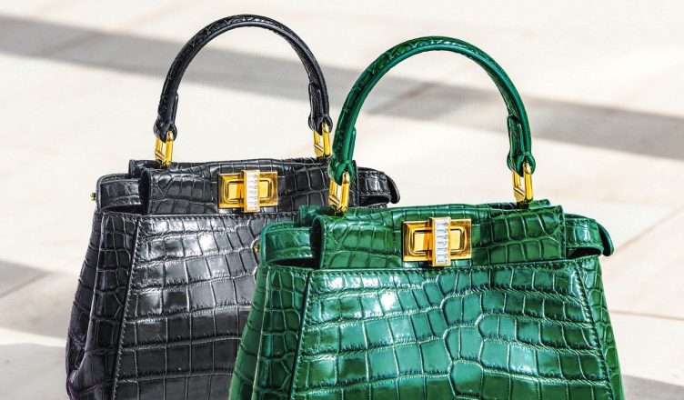 Elevate your style with these exquisite green and black crocodile pattern handbags, perfect for a luxury fashion statement. —