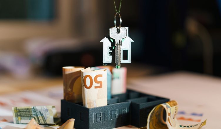 House key over Euro banknotes symbolizes real estate investment and financial planning. — Can Small Investors Invest in Mutua