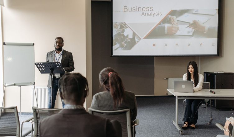 Business seminar with a speaker and audience in a conference room. — Choosing Quality Garage Flooring Installers is the Best
