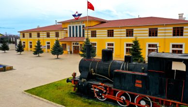 A vintage steam locomotive displayed at the Sivas Railway Station in Turkey, showcasing historical transport heritage. — CONC