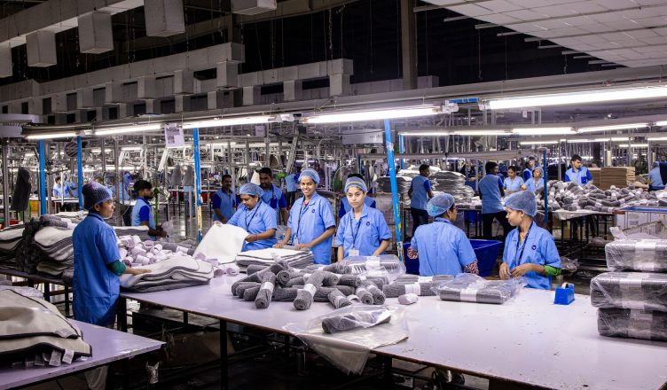 Indian textile factory workers expertly packaging products on an assembly line. — Everything You Need to Know About Precision