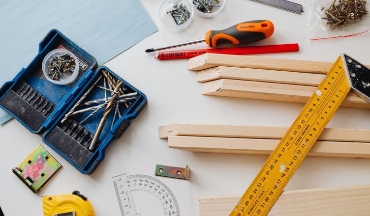 A top view of various woodworking tools and materials on a white table. — High-Quality MDF Cut to Size Panels Designed for Sm