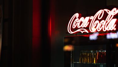 A classic Coca-Cola neon sign illuminating a dark room with vibrant red glow. — How long does TPMS take to relearn?