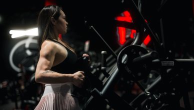 Focused woman engaging in a strength training session at the gym using robust fitness machinery. — How Steroids for Sale in t
