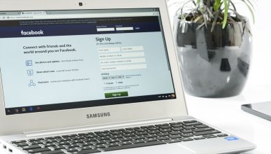 Open Samsung laptop showing Facebook sign-up page next to a potted plant. Ideal for technology themes. — How to become the gr