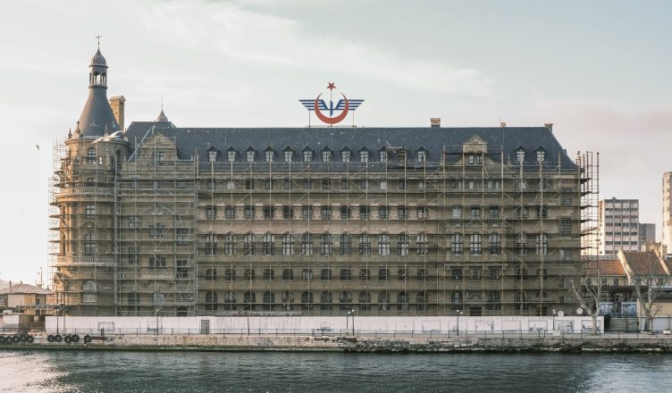 Scaffolding on a historic waterfront building under renovation. — Mobile Gaming Redefined: GTA 5's Incredible Features