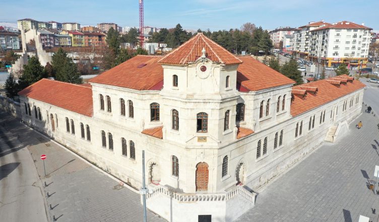 Aerial view of a historic stone building with red tile roofs in Sivas, Turkey, on a sunny day. — Predictive Maintenance: Thin
