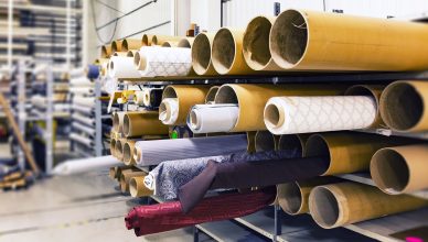Rows of textile rolls stored in a factory for industrial manufacturing. — Restaurants for Groups: How to Serve Your Clients O