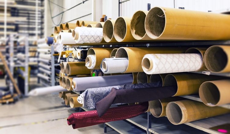 Rows of textile rolls stored in a factory for industrial manufacturing. — Restaurants for Groups: How to Serve Your Clients O