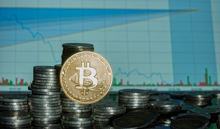 Stack of coins with Bitcoin emblem against a financial market graph, highlighting economic trends. — Tips for Getting Out Of