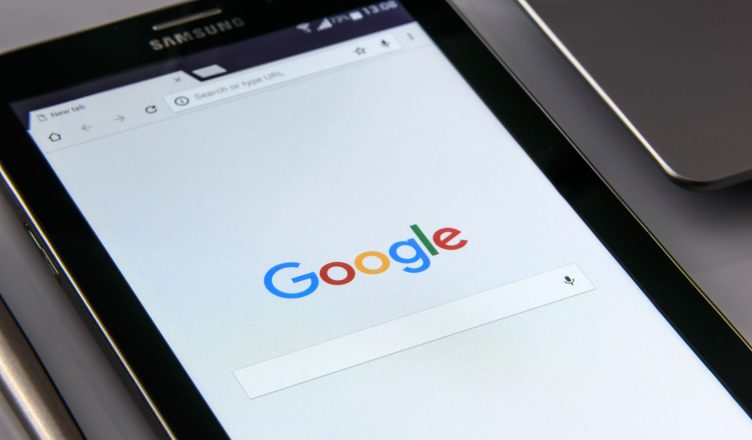 Close-up of a tablet displaying Google's search screen, emphasizing technology and internet browsing. — Top 5 Best and Top Op