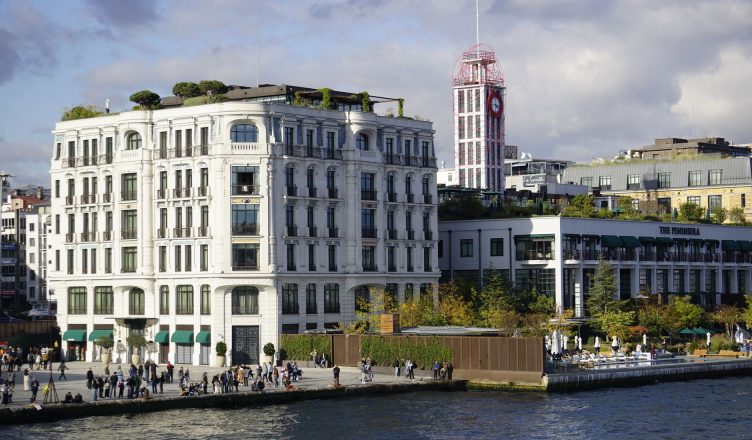 Scenic view of historical buildings on Istanbul's waterfront, bustling with activity. — What are the three principles of phot