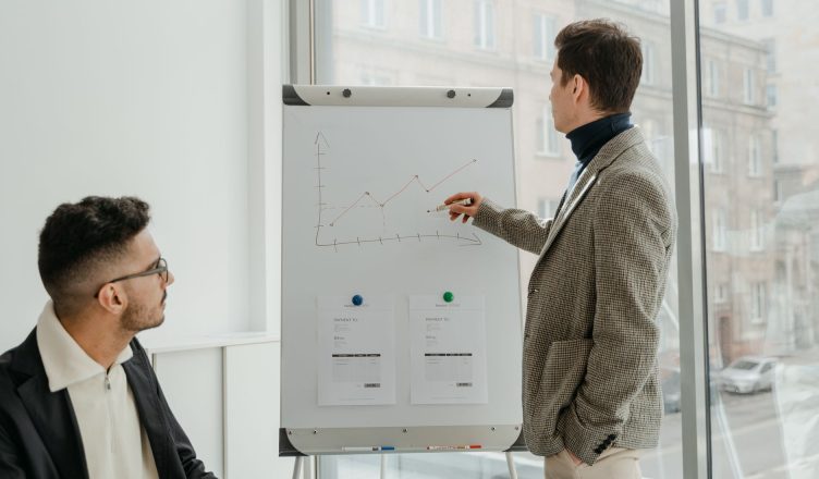 Two professionals examining graphs during an office presentation. — what makes bereche fils wine so special