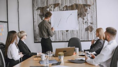 Group of business professionals discussing strategies with growth chart in conference room. — Why an automated industrial sec