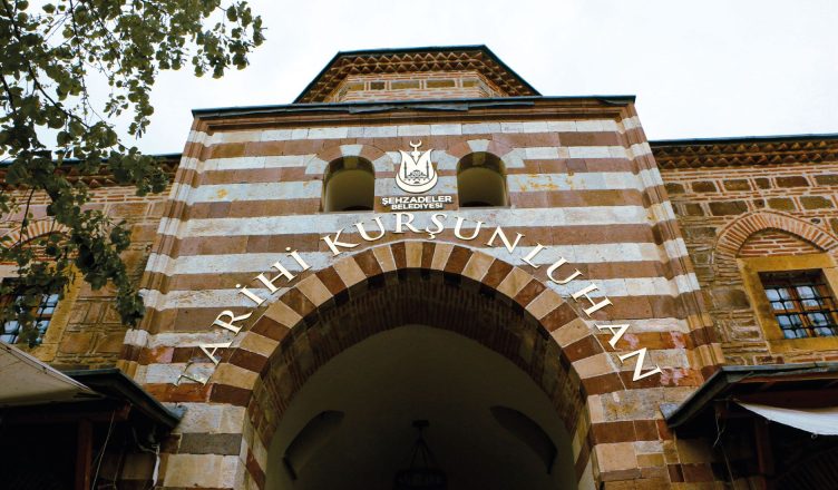 Entrance of the historic Kurşunlu Han in Manisa, Türkiye featuring traditional Ottoman architecture. — Why Women Should Consi